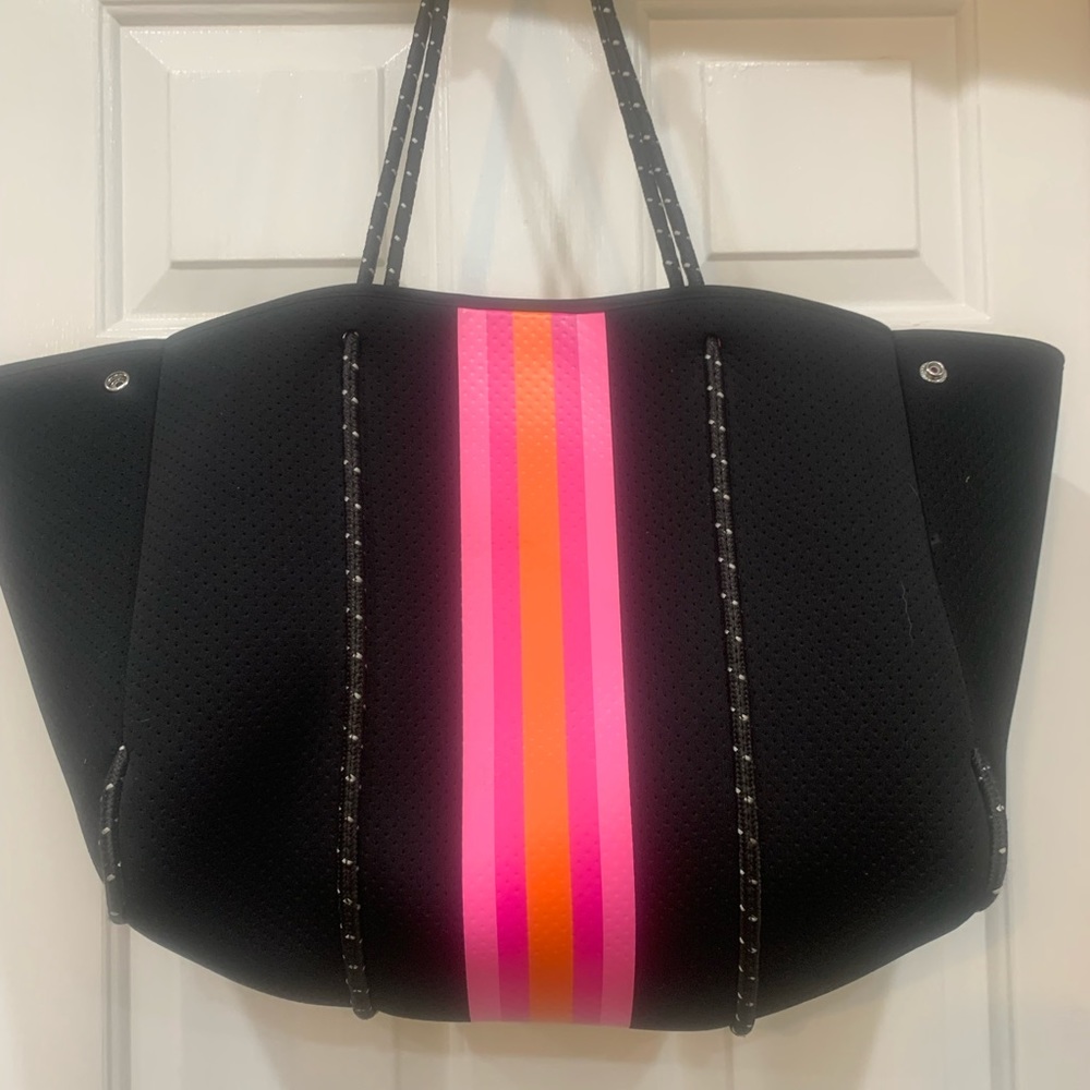 Haute Shore black neoprene tote with orange and pink stripes